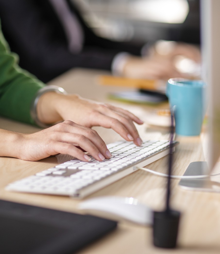 Close up shot of person typing on keyboard.